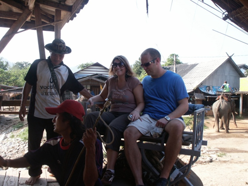 Jessica R. Patch riding an elephant in Thailand